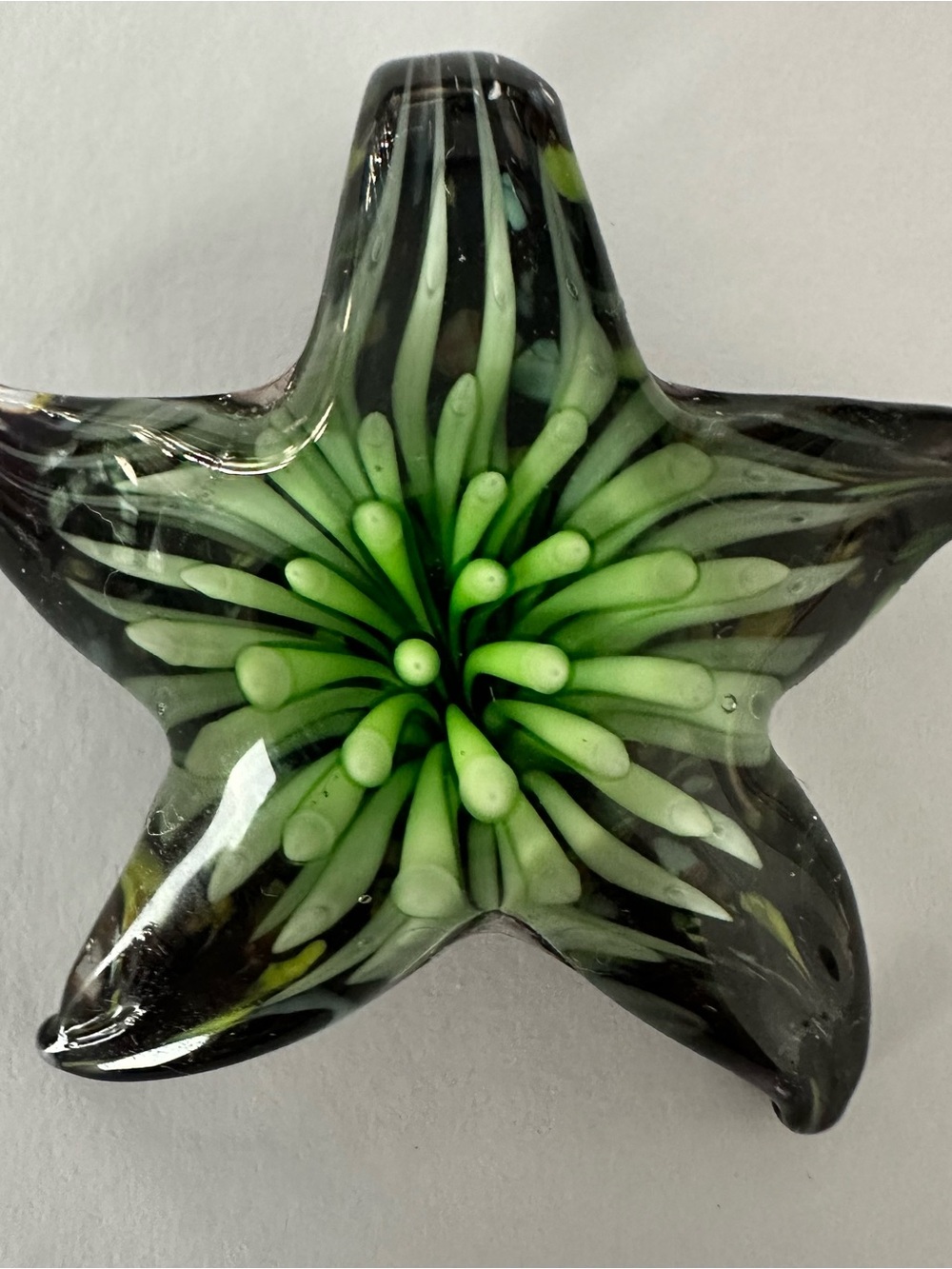 Green Starburst Glass necklace pendant; new; 1.5x1.5”